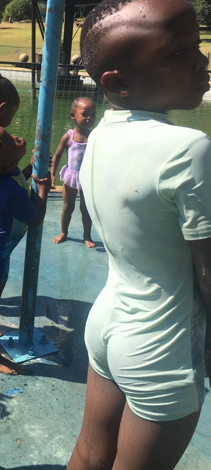 Black boy at water park