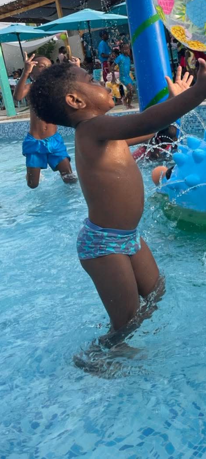 Black boy at water park